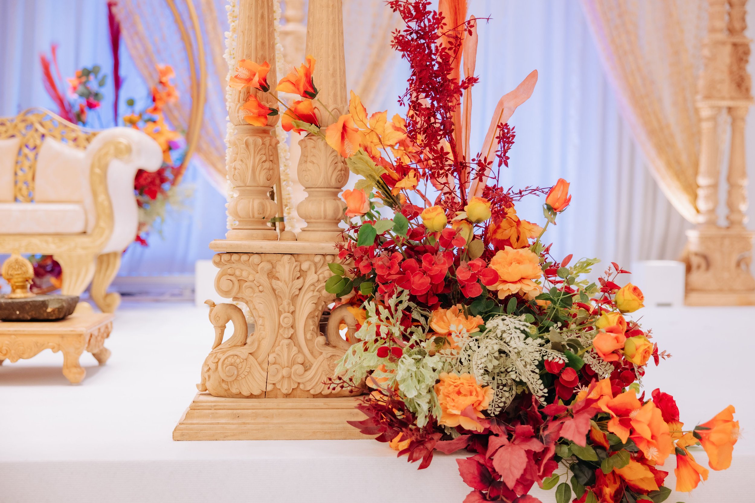 red-orange-flowers-wooden-mandap